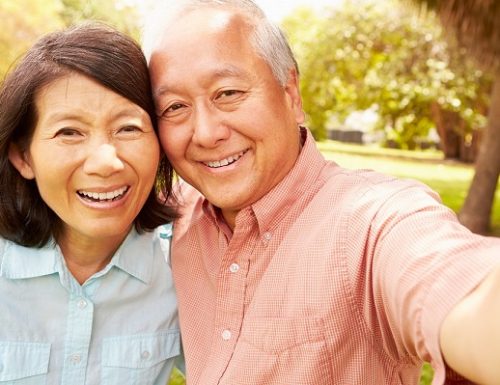 Senior,Asian,Couple,Taking,Selfie,In,Park,Together